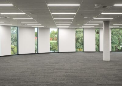 An empty office space ready for rent, with an acoustic ceiling and Apex ceiling tiles.